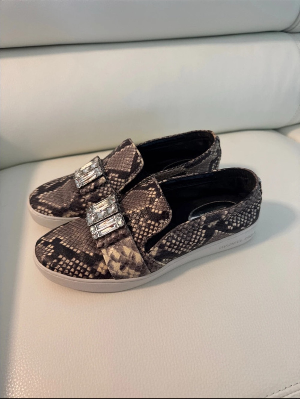 MICHAEL KORS SLIP-ON SNAKE PRINT SNEAKERS WITH GEM EMBELLISHMENT- BLACK/ aGRAY